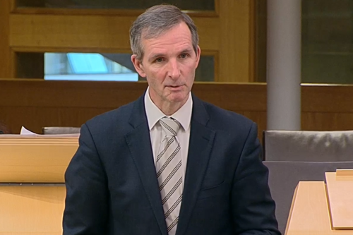 McArthur speaking in chamber