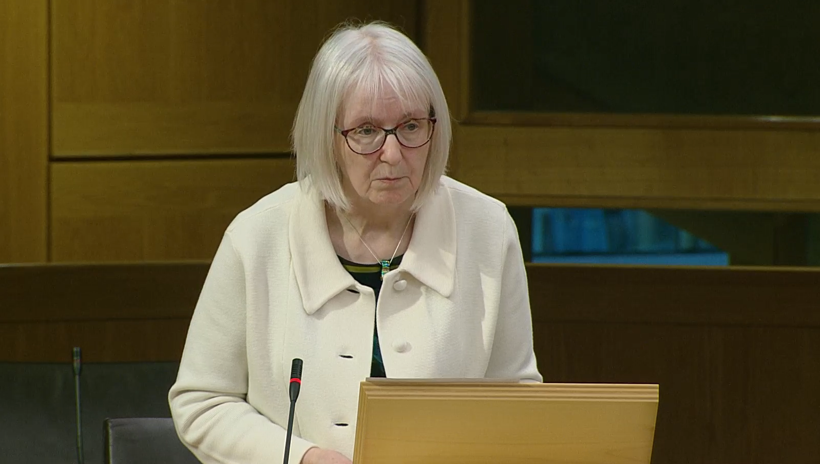 Beatrice Wishart MSP stands at her lectern in the Scottish Parliament 